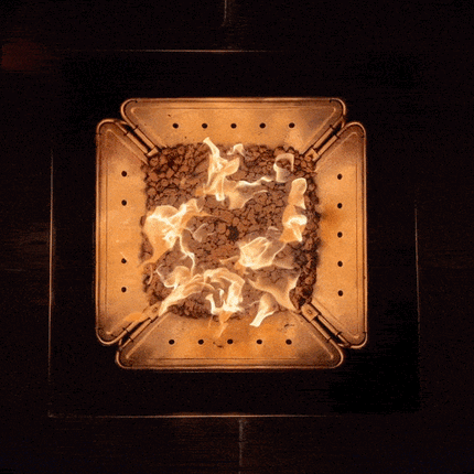 Smokeless propane campfire powered by the Zutto SP1 adapter in a Snow Peak Takibi fire pit, viewed from above with Jikaro table
