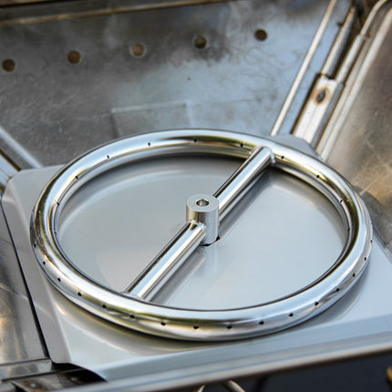 Angled view of the Zutto SP1 smokeless propane gas adapter installed in a Snow Peak Takibi L fire pit without lava rocks, showing the burner components