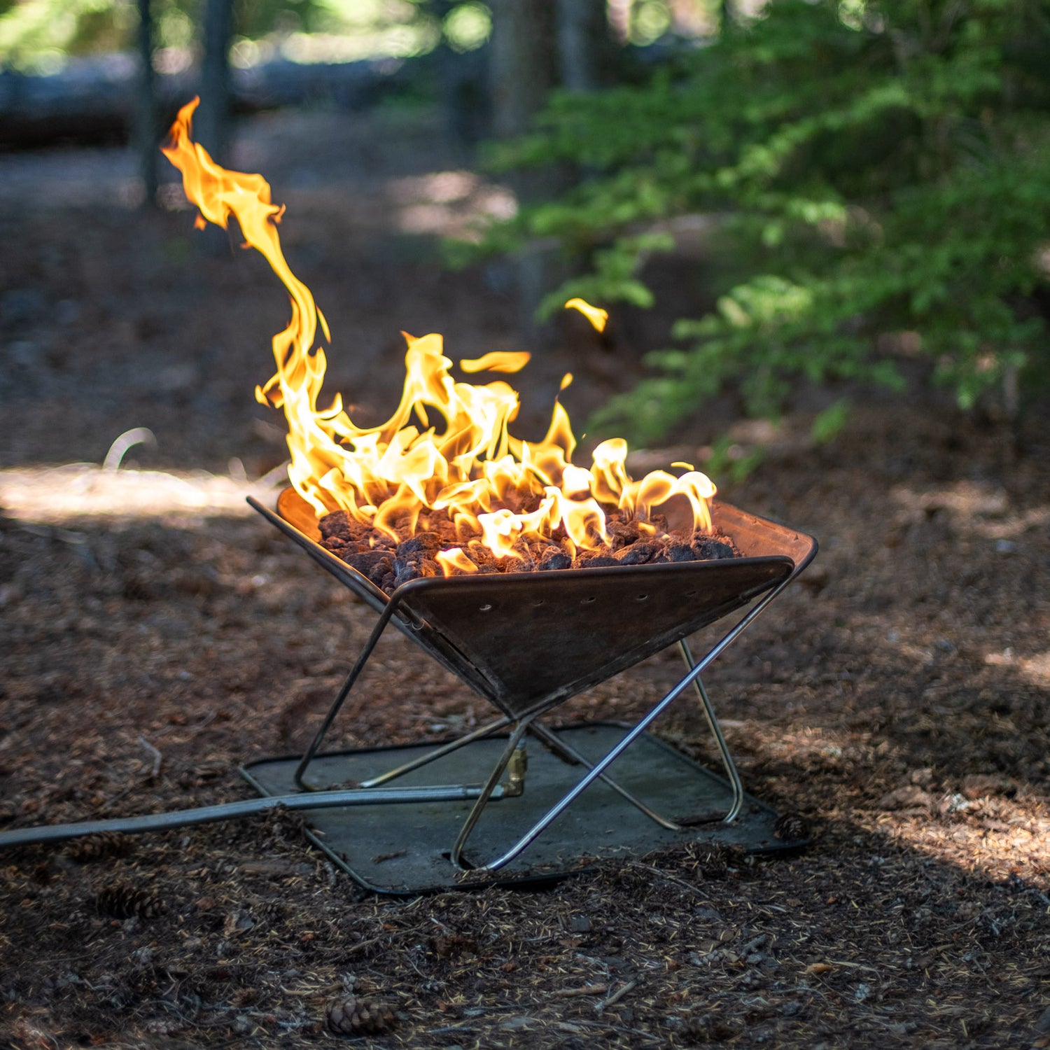 Image of the Zutto in use, a propane adapter for snow peak takibi grill fire pit campfire